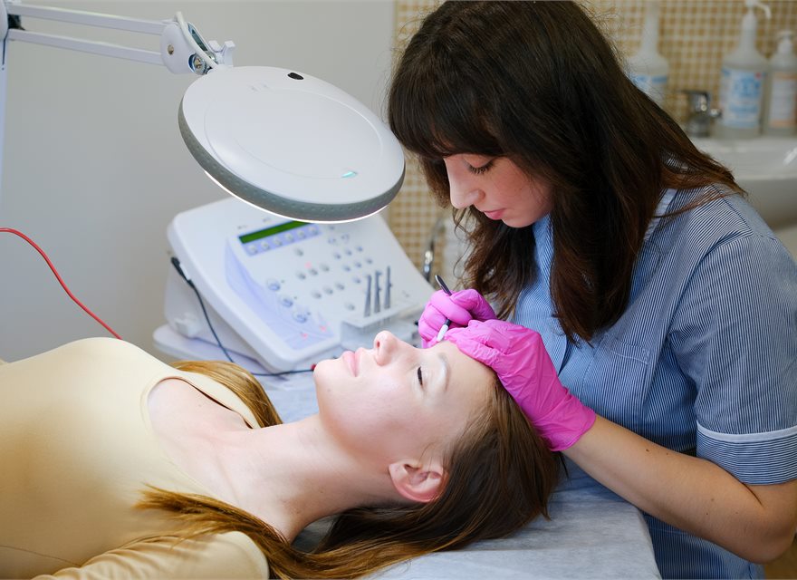 IB-Probe hair removal treatment on a client's eyebrow area